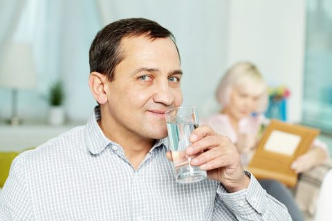 man drinking water for prostate