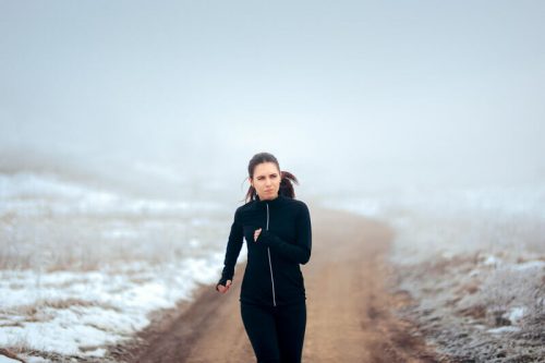 woman jogging in cold temperature
